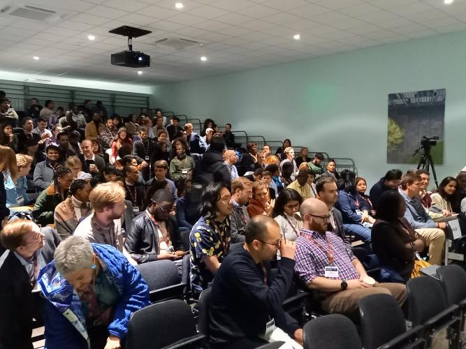 Photograph of a full lecture theatre at the CSAE Conference 2024