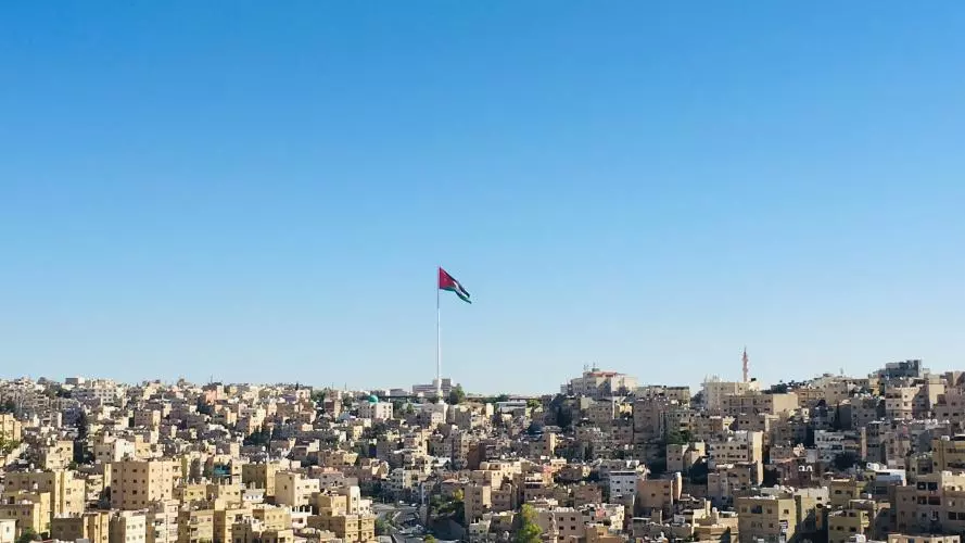 Image of Amman with Jordan flag flying high
