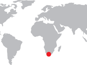 World map with a red dot over the country South Africa