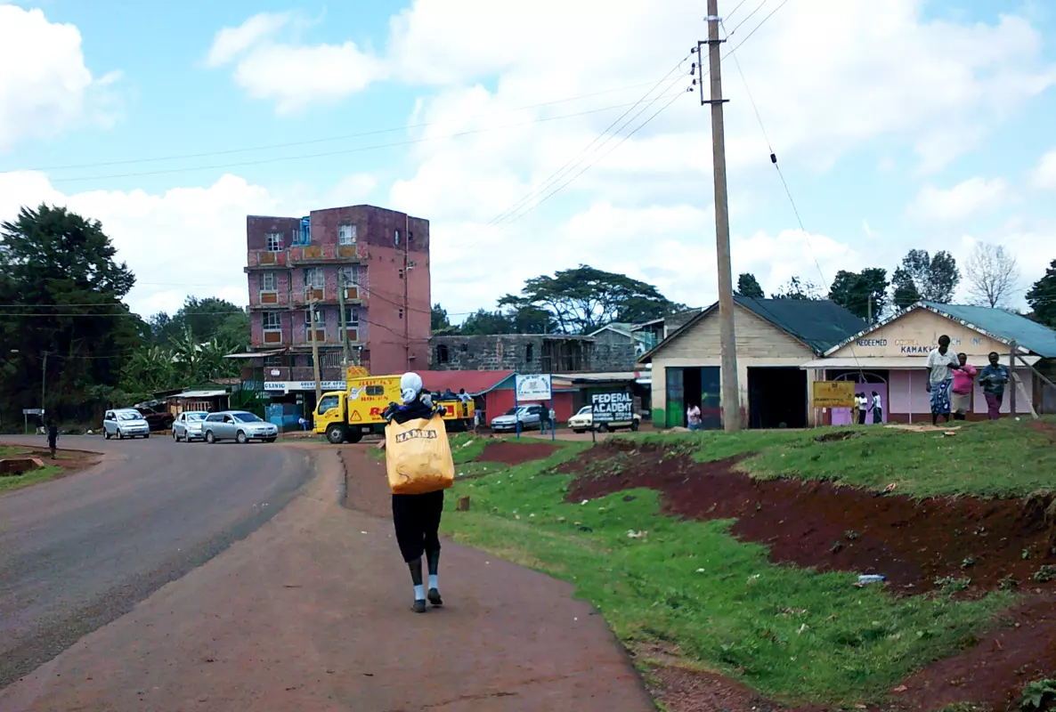 Person carrying chewing gum in a bag to sell in Kenya
