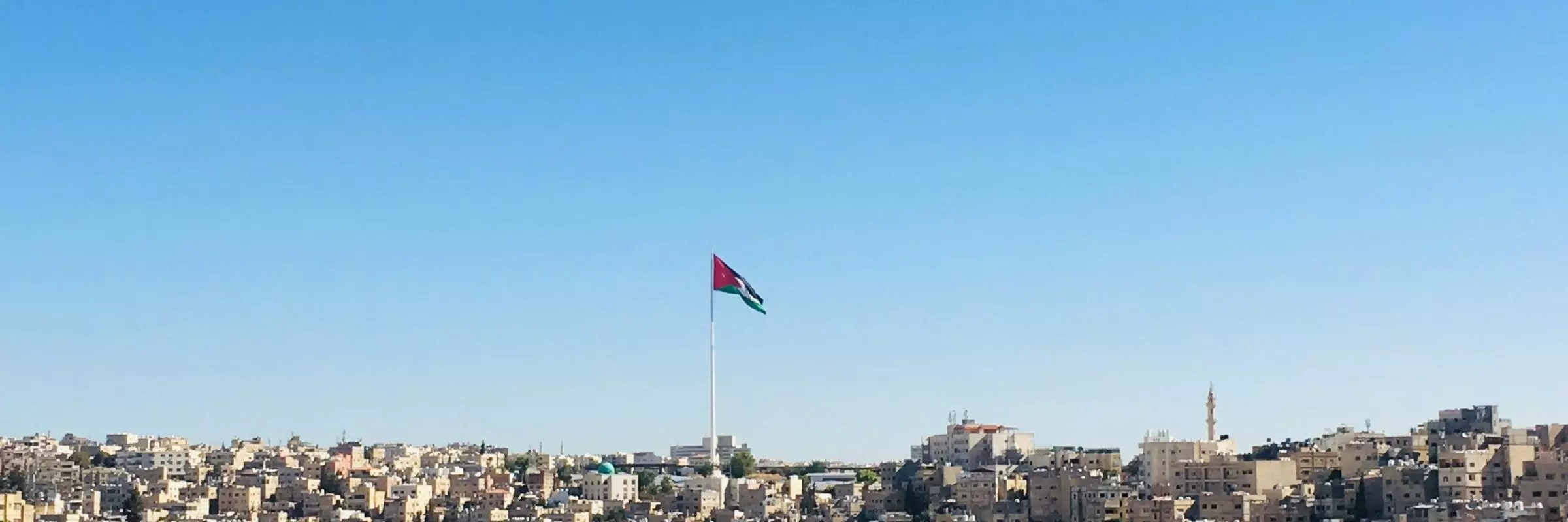 Image of Amman with Jordan flag flying high