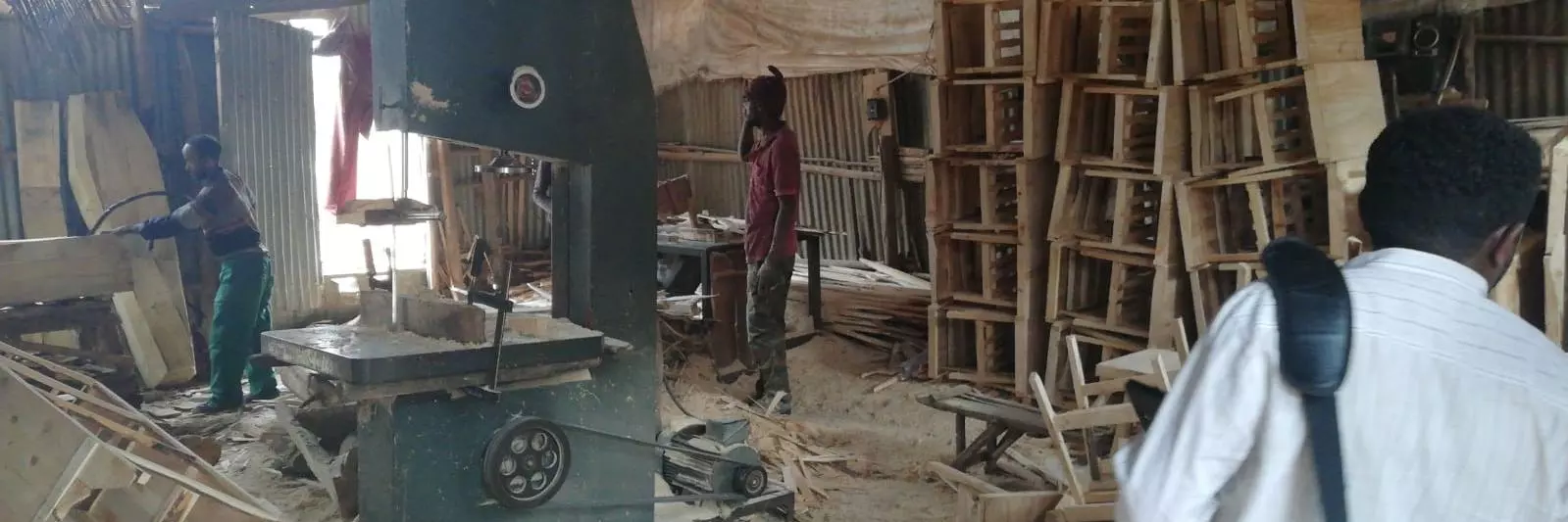 Men working in a messy factory in Addis Ababa