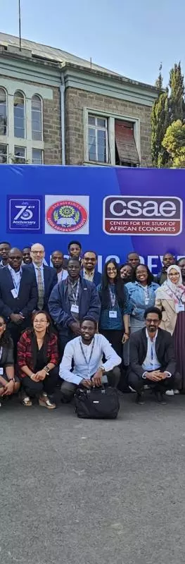 Large group of participants gather in front of the workshop banner at Addis Ababa University, Ethiopia