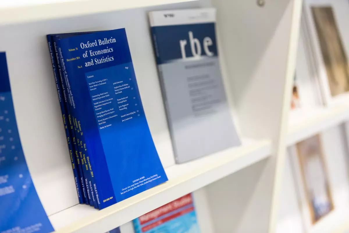 Photo of economics books on shelves