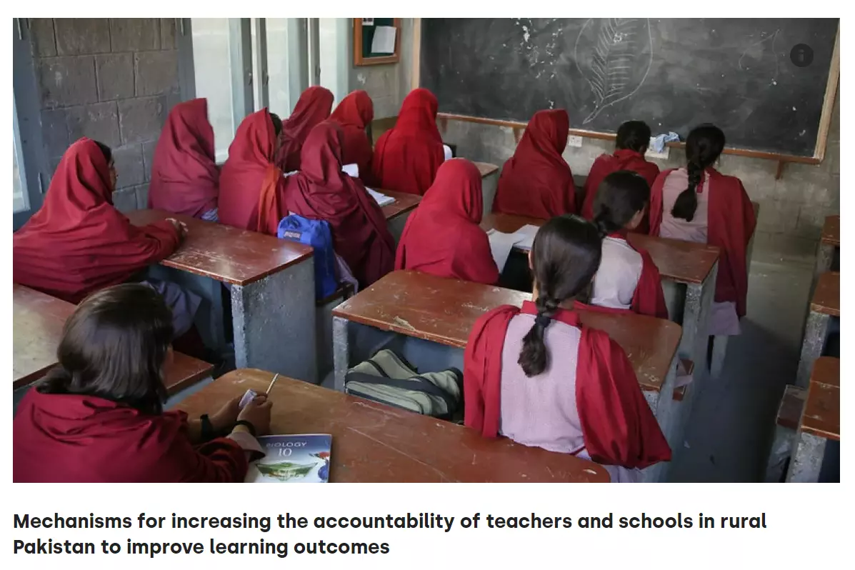 Women facing black board with red uniform in Pakistan