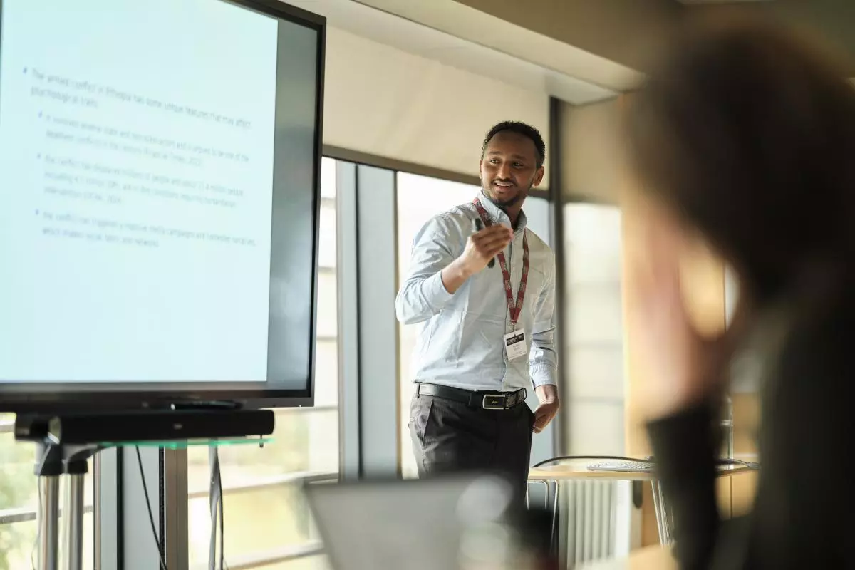 Photo of Halefom Nigus presenting at the CSAE Conference 2025
