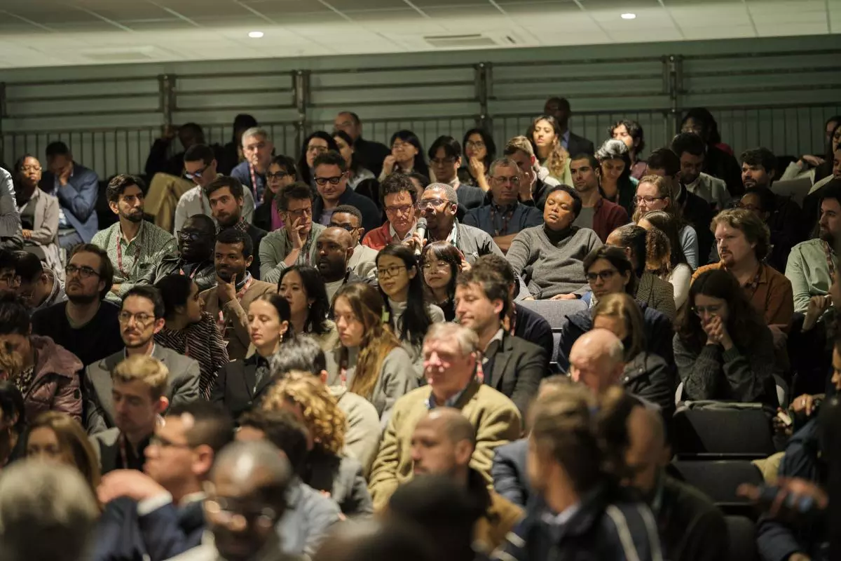 A question is asked in a full lecture theatre at the CSAE Conference